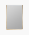 A rectangular gold-framed wall mirror with a plain surface. | Wildwood Home Co.