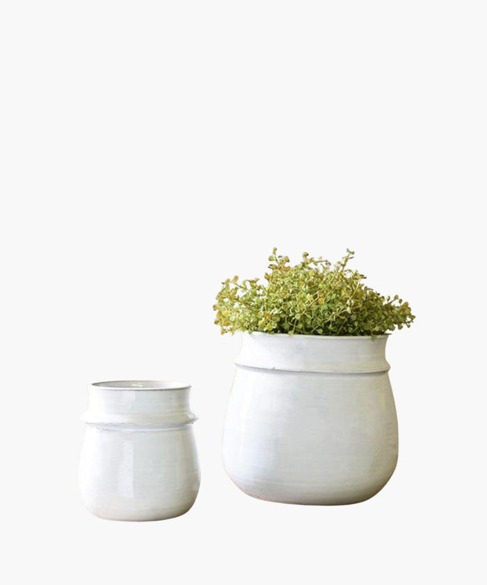 Two white planters, one with a small plant, on a white background. | SW Home