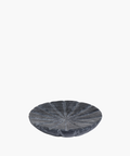 A round, textured gray stone bowl with a segmented, flower-like design on its surface. The bowl has a modern, minimalist aesthetic, conveying elegance. | SW Home