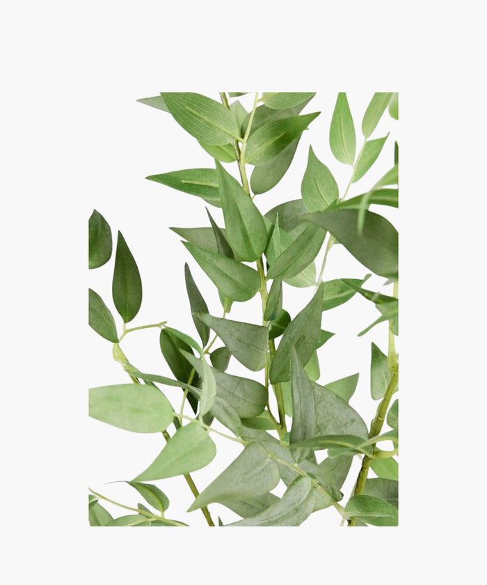 Artificial green leaves on a white background. | SW Home