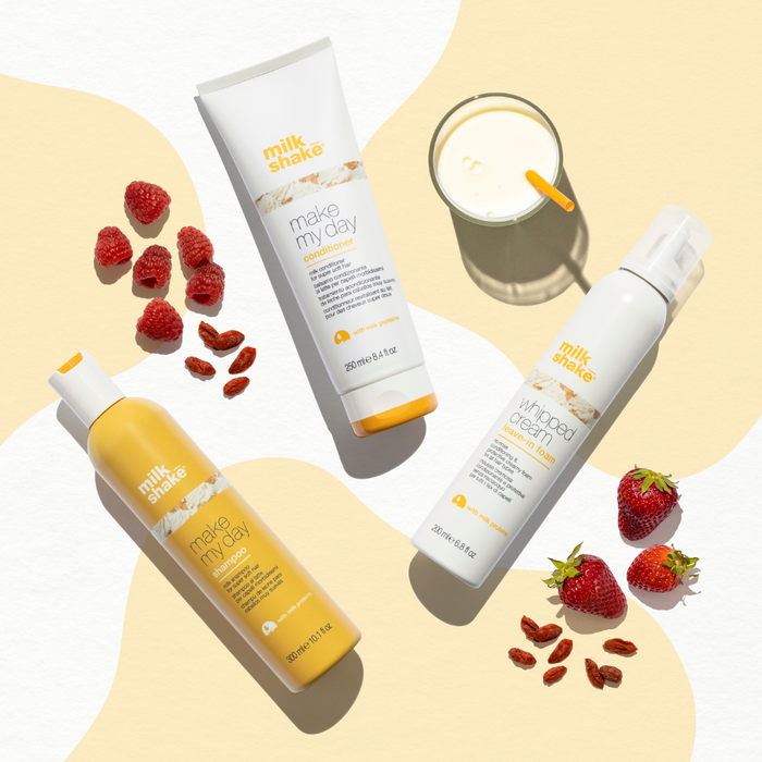 milk_shake skincare products with strawberries and a glass of milk on a light background