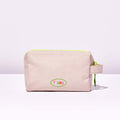 Fussy's Recycled Washbag in pale pink with a lime green zip and Fussy logo