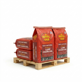 Three bags of Royal Oak lump charcoal on a wooden pallet with a white background