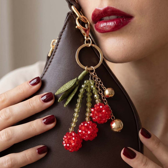 Cherry bag charm with glossy acrylic beads, raffia fringe and metal chain detail for totes