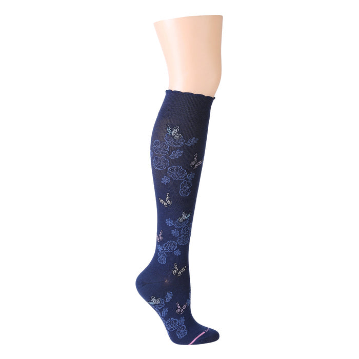 Knee-high compression socks in navy with whimsical butterfly and floral patterns.