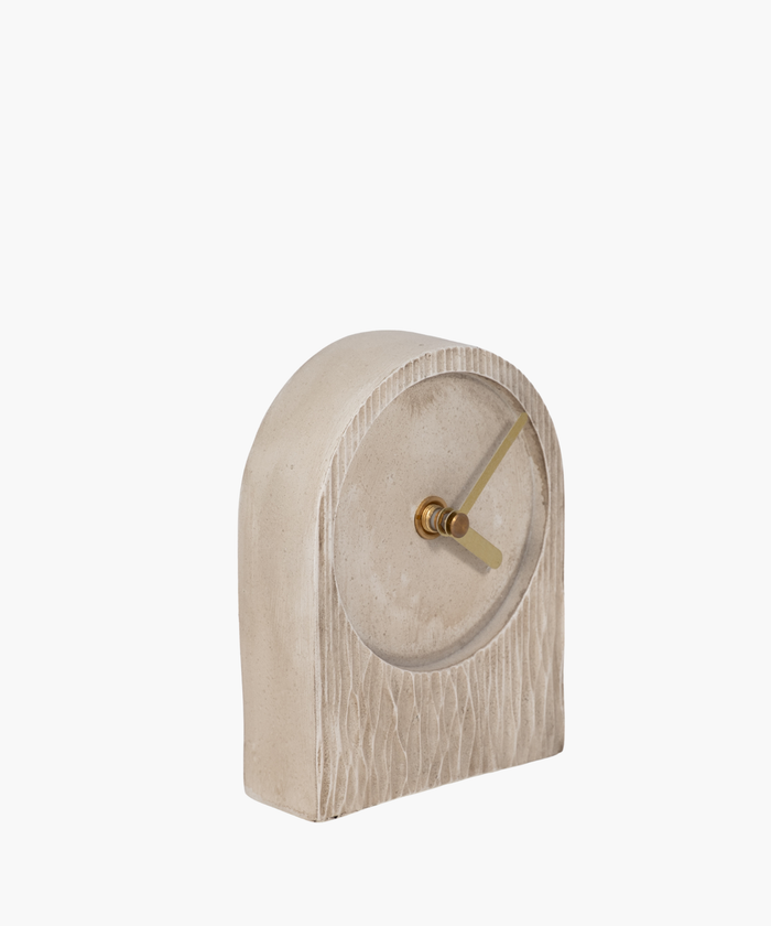 A minimalist beige clock with a textured arch shape, featuring sleek gold hour and minute hands. The design conveys simplicity and elegance. | SW Home